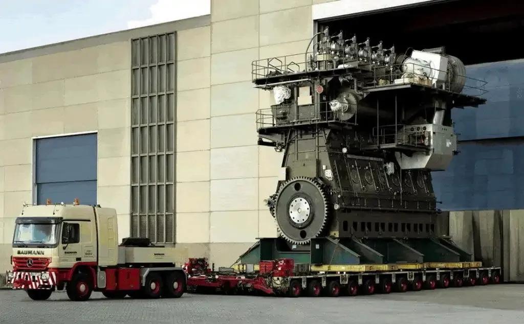 “Massive Wärtsilä-Sulzer RTA96-C ship engine inside industrial engine room”