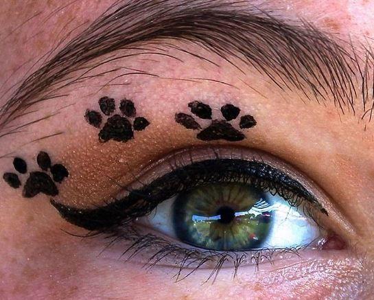 Woman honors late pet dog by mixing ashes into eyeliner tattoo ink as a lasting memorial tribute.
